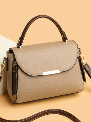 Stylish beige handbag with shoulder strap.